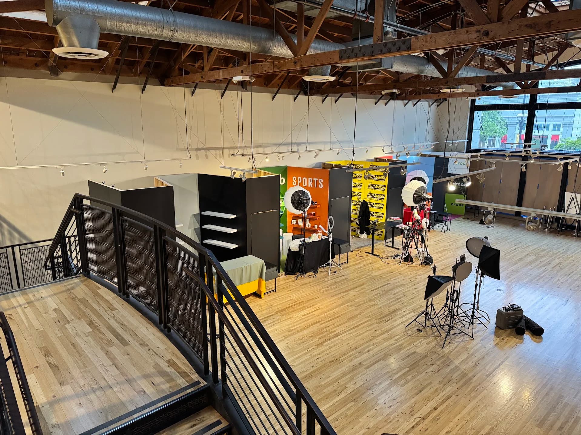 Completed Outlandish and TikTok live-shopping production floor with branded stations, lighting, and camera positions
